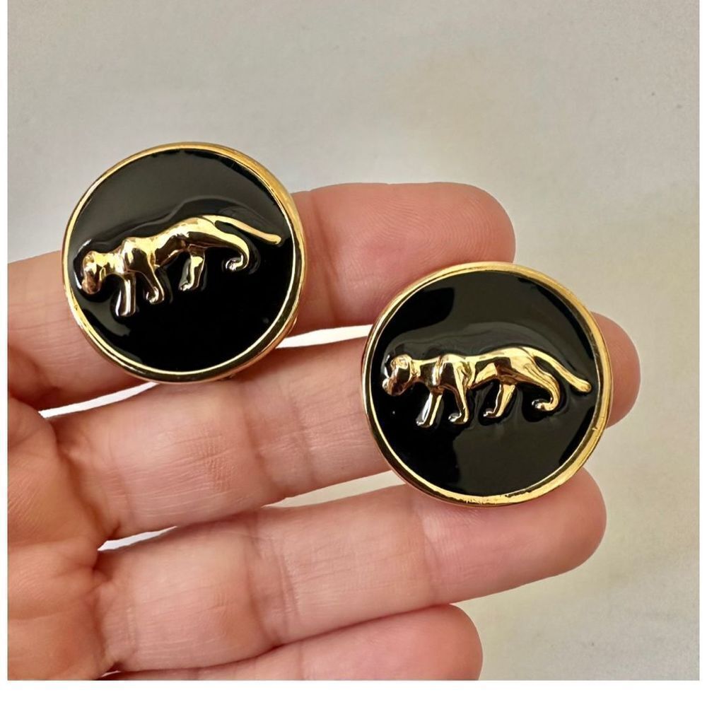Black and gold tone leopard clip on earrings